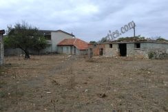 plot with a small house on it