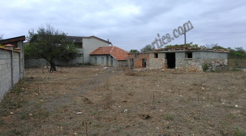 plot with a small house on it